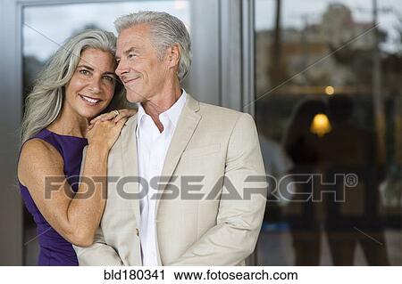Stock Image - Older Caucasian couple hugging. Fotosearch