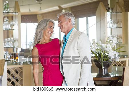 Stock Image - Older Caucasian couple hugging. Fotosearch