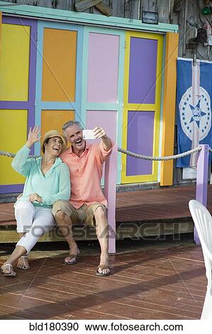 Stock Image - Older Caucasian couple taking selfie. Fotosearch