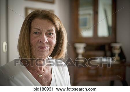 Stock Image - Older Caucasian woman smiling indoors. Fotosearch