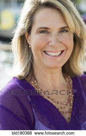 Older Caucasian woman smiling outdoors View Large Photo Image Stock Photo - Older Caucasian woman smiling outdoors. Fotosearch