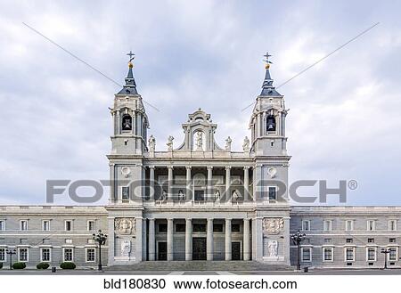 Stock Image - "Ornate cathedral and cloudy sky, Madrid, Madrid, Spain". Fotosearch