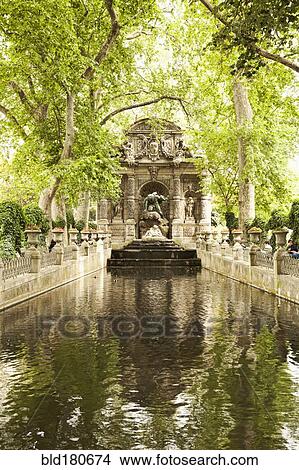 Ornate statue over park stream View Large Photo Image Picture - Ornate statue over park stream. Fotosearch