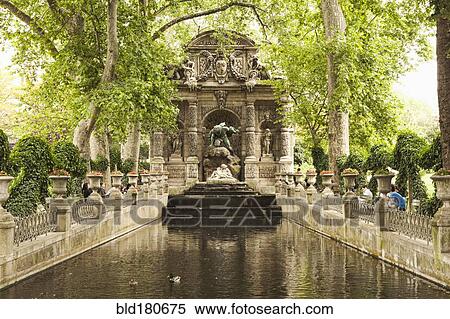 Ornate statue over park stream View Large Photo Image Stock Photography - Ornate statue over park stream. Fotosearch
