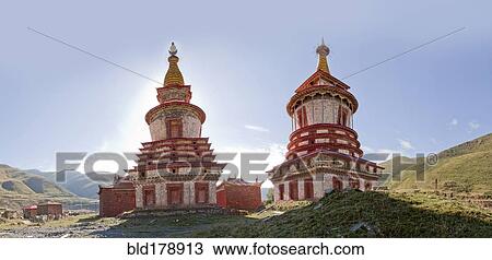 Stock Image - Ornate traditional towers in remote landscape. Fotosearch