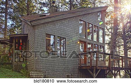 Stock Image - Patio and exterior of modern house. Fotosearch