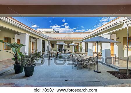 Patio furniture in modern courtyard View Large Photo Image Stock Photo - Patio furniture in modern courtyard. Fotosearch