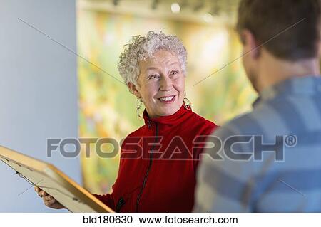 People talking in art gallery View Large Photo Image Stock Image - People talking in art gallery. Fotosearch