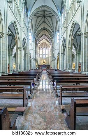 Stock Photography - Pews and arches in ornate church. Fotosearch