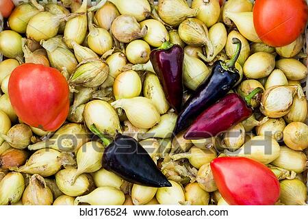 Picture - Pile of onions, peppers and tomatoes. Fotosearch