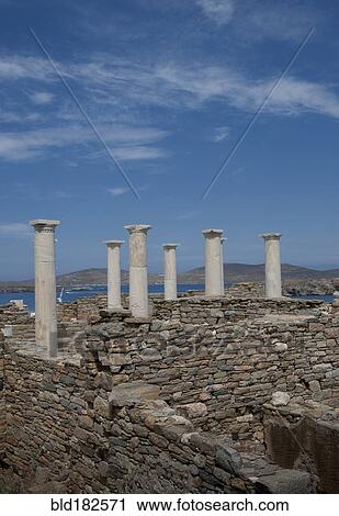 Stock Image - Pillars and ruin walls, Delos, Cyclades, Greece. Fotosearch