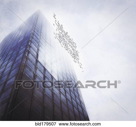 Stock Photo - Pixelated highrise building and cloudy sky. Fotosearch