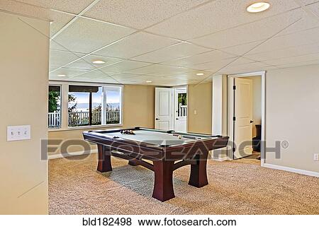 Pool table in game room View Large Photo Image Stock Photo - Pool table in game room. Fotosearch