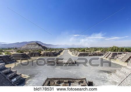 Stock Image - Pyramid ruins under blue sky, San Juan Teotihuacan, State of Mexico, Mexico. Fotosearch
