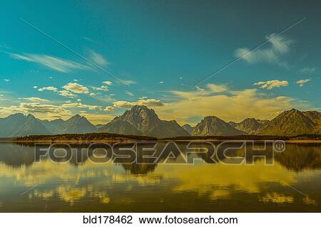 Reflection of mountains in remote lake View Large Photo Image Stock Image - Reflection of mountains in remote lake. Fotosearch