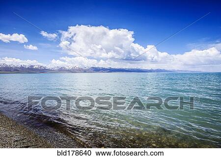 Remote lake and shore with blue sky View Large Photo Image Stock Image - Remote lake and shore with blue sky. Fotosearch