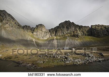 Rocky cliffs in remote field View Large Photo Image Stock Image - Rocky cliffs in remote field. Fotosearch