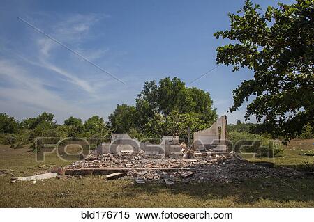 Stock Photography - Rubble of demolished building in rural field. Fotosearch