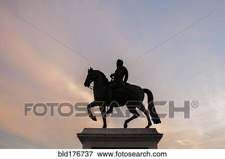Silhouette of horse and rider statue under sunset sky View Large Photo Image Stock Photo - Silhouette of horse and rider statue under sunset sky. Fotosearch