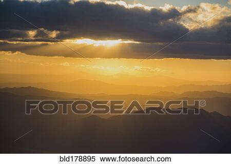 Stock Photography - Silhouette of mountains in remote landscape. Fotosearch