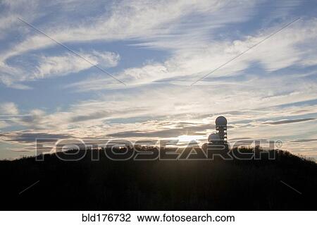 Silo on rural hilltop under cloudy sky View Large Photo Image Stock Image - Silo on rural hilltop under cloudy sky. Fotosearch