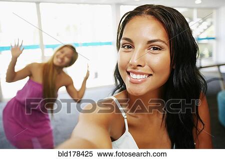 Smiling women posing indoors View Large Photo Image Stock Photography - Smiling women posing indoors. Fotosearch
