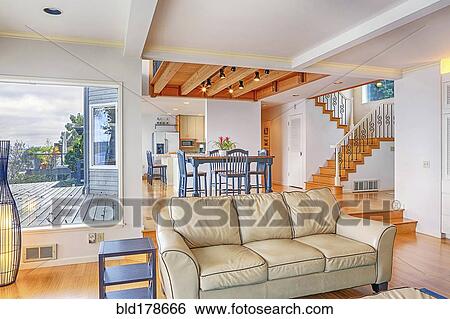 Sofa and dining table in modern living space View Large Photo Image Stock Photograph - Sofa and dining table in modern living space. Fotosearch