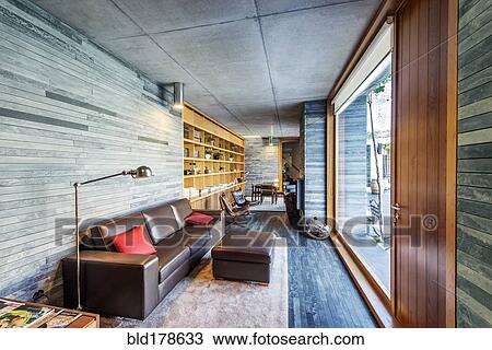 Sofa and glass wall in modern room View Large Photo Image Stock Image - Sofa and glass wall in modern room. Fotosearch