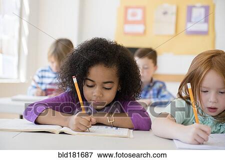Stock Photo - Students working in classroom. Fotosearch