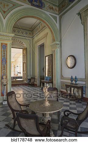 Table and chairs in ornate room View Large Photo Image Stock Photo - Table and chairs in ornate room. Fotosearch
