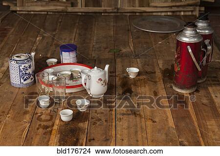 Tea place settings on wooden floor View Large Photo Image Picture - Tea place settings on wooden floor. Fotosearch
