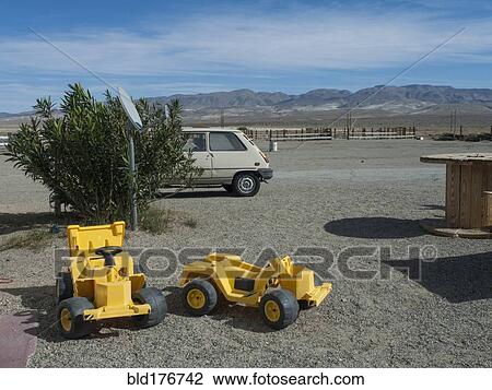 Toy bulldozers in rural desert park View Large Photo Image Stock Image - Toy bulldozers in rural desert park. Fotosearch