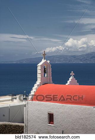 Picture - Traditional bell arch and seascape under blue sky. Fotosearch