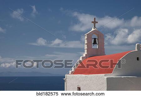 Stock Photography - Traditional bell arch and seascape under blue sky. Fotosearch