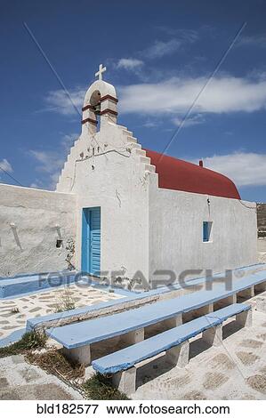 Stock Photo - Traditional church entrance and walkway under blue sky. Fotosearch