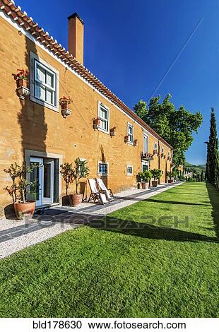 Traditional hotel and grass walkway View Large Photo Image Stock Image - Traditional hotel and grass walkway. Fotosearch