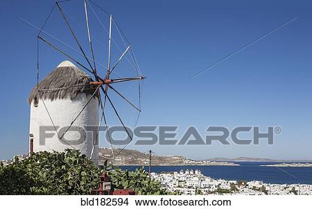 Traditional windmill and Mykonos cityscape, Cyclades, Greece View Large Photo Image Picture - Traditional windmill and Mykonos cityscape, Cyclades, Greece. Fotosearch