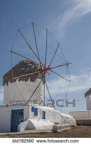 Stock Image - Traditional windmill under blue sky. Fotosearch