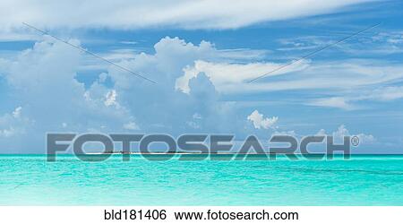 Stock Photograph - Tropical ocean under blue sky. Fotosearch