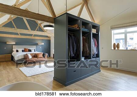 Wardrobe and bed in modern bedroom View Large Photo Image Stock Image - Wardrobe and bed in modern bedroom. Fotosearch