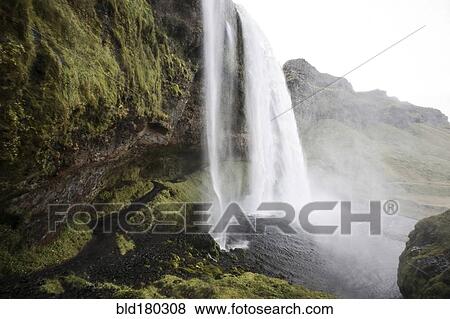 Stock Photo - Waterfall over rock formation cliffs. Fotosearch