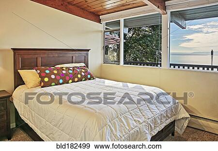 Window and bed in bedroom View Large Photo Image Stock Photo - Window and bed in bedroom. Fotosearch