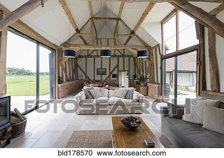 Stock Image - Windows and sofa in modern living room. Fotosearch