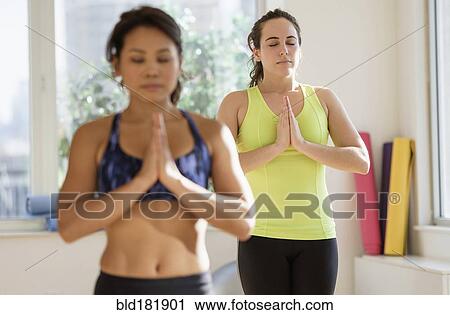 Women practicing yoga in studio View Large Photo Image Stock Image - Women practicing yoga in studio. Fotosearch