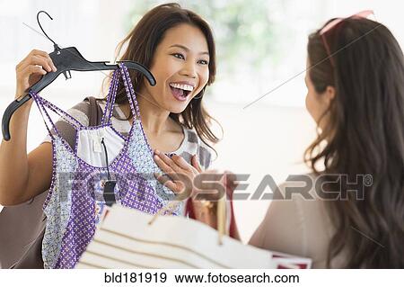 Stock Photo - Women shopping in store. Fotosearch