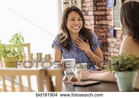 Women talking in coffee shop View Large Photo Image Picture - Women talking in coffee shop. Fotosearch
