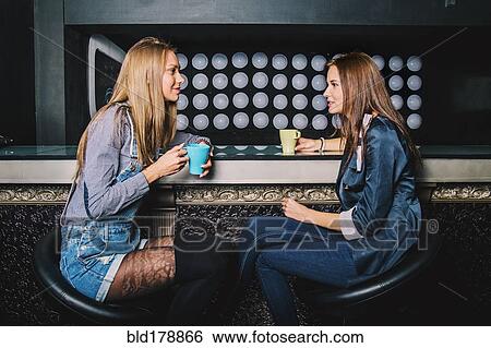 Women talking in coffee shop View Large Photo Image Stock Photograph - Women talking in coffee shop. Fotosearch