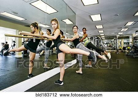 Women working out at barre in gymnasium View Large Photo Image Stock Image - Women working out at barre in gymnasium. Fotosearch