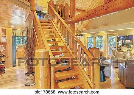 Stock Photo - Wooden staircase in rustic home. Fotosearch