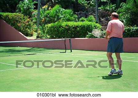 amateur tennis player engaged in a match View Large Photo Image Stock Image - amateur tennis player engaged in a match. Fotosearch